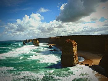 Scenic view of sea against cloudy sky
