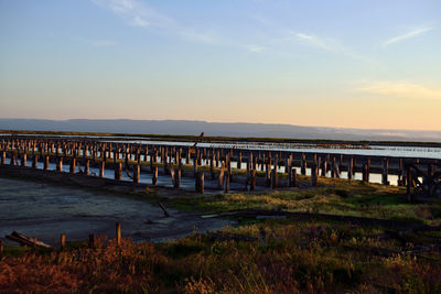 Scenic view of beach against sky during sunset