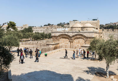 Group of people in front of historical building