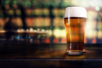 Close-up of beer glass on table