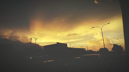 Silhouette of trees against sky at sunset