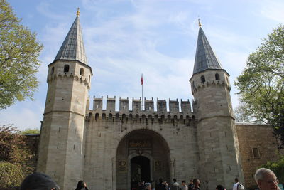 Group of people in front of historical building