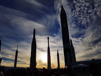 Low angle view of silhouette temple against sky at sunset