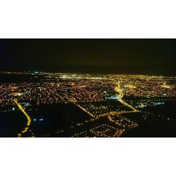 Illuminated cityscape at night