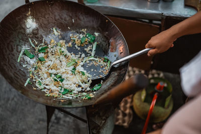 Midsection of man preparing food