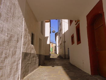 Rear view of woman walking on corridor