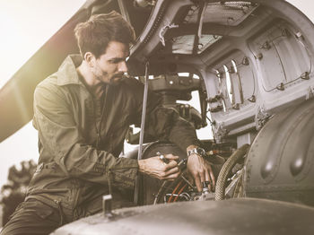 Mechanic repairing a helicopter