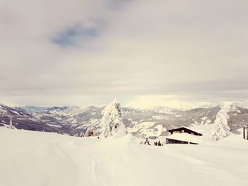 Scenic view of snowcapped mountains against sky