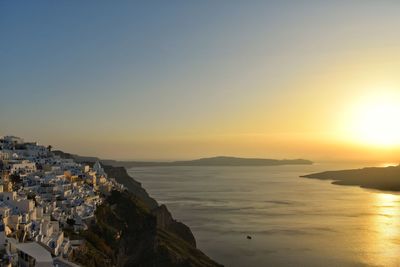 Scenic view of sea against clear sky during sunset