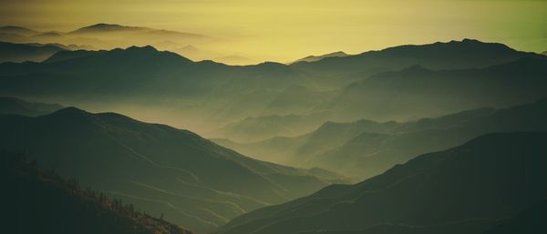 Scenic view of mountains against sky during sunset