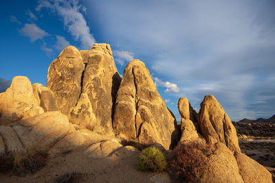 Rock formation on land against sky