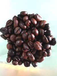 Close-up of coffee beans against white background