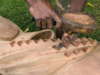 Low section of man working on wood