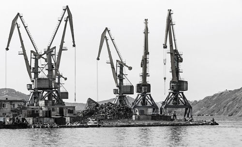 Crane at the scrapyard in the seaport in kamchatka peninsula