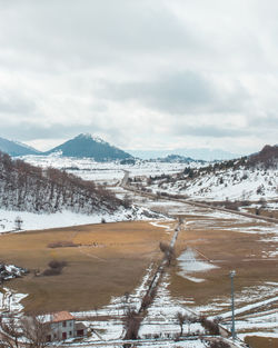 Scenic view of snowcapped mountains against sky