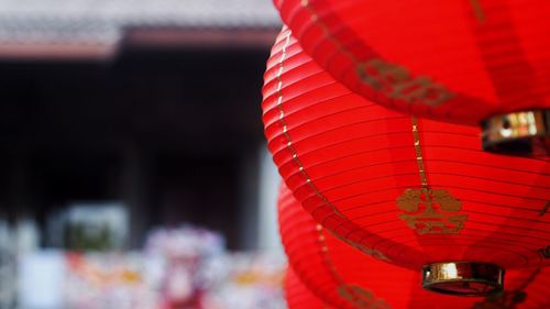 Low angle view of illuminated lanterns hanging at night