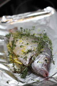 Close-up of fish served in silver foil