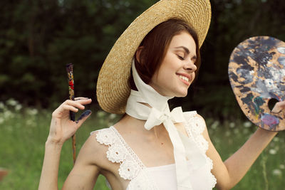 Young woman wearing hat