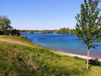 Scenic view of land against clear blue sky