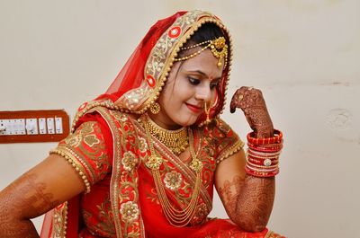 Close-up of bride against wall