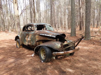 Abandoned car on field
