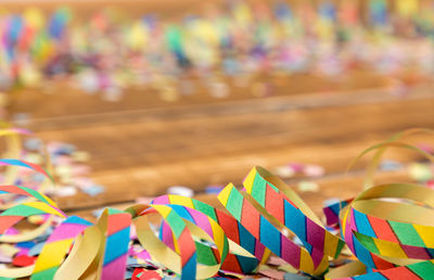 High angle view of streamers on wooden table