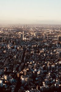 High angle view of city buildings against clear sky