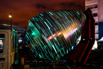 Low angle view of illuminated city at night