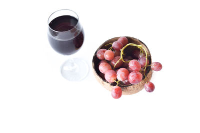 High angle view of drink on table against white background