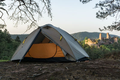 Tent on field against sky