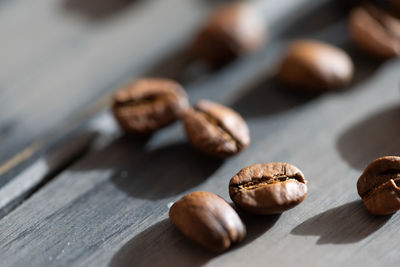 Close-up of roasted coffee beans on table