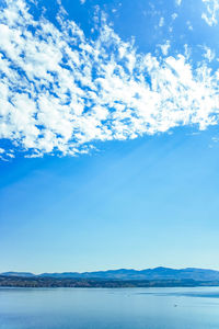 Scenic view of sea against blue sky