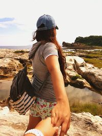 Low angle view of woman on beach