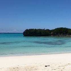 Scenic view of sea against clear blue sky