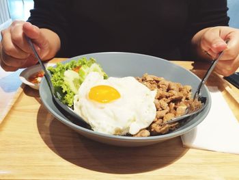 Close-up of man having breakfast