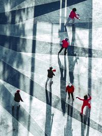 High angle view of people walking on floor