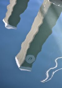 High angle view of reflection of clouds in sea