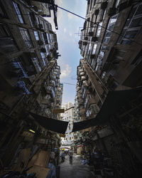 Fish-eye view of buildings against sky