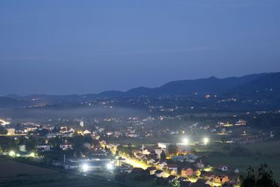 High angle view of illuminated buildings in city at night