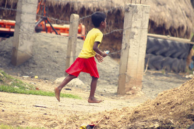 Full length of woman standing on field