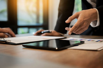 Close-up of person working on table