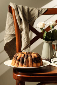 Homemade marble bundt cake on rustic background. concept rustic poster bakery menu