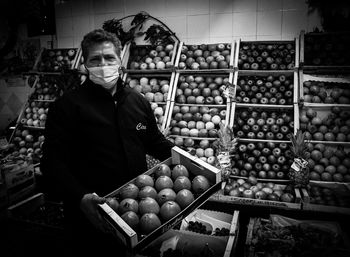 Man standing in market stall