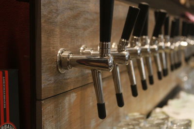 Row of beer taps at microbrewery