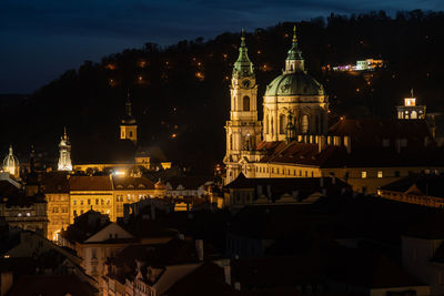 Illuminated buildings in city at night