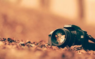 Close-up of camera against blurred background