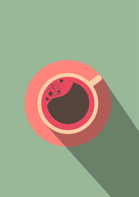 High angle view of red coffee cup against white background