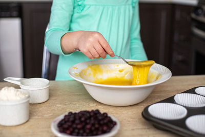 Midsection of woman having food