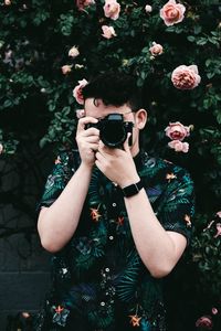 Portrait of man photographing