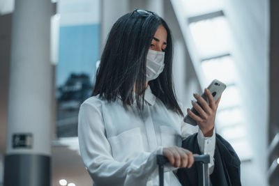 Young woman using mobile phone